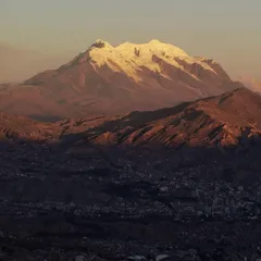 The Illimani glowing at sunset above the bowl of La Paz