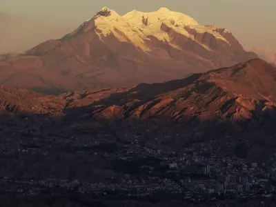 The Illimani glowing at sunset above the bowl of La Paz