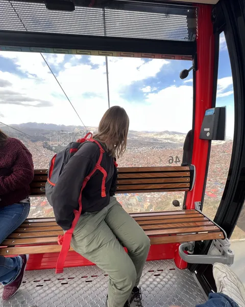 Inside a Mi Teleférico cabin, the city below