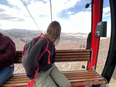 Inside a Mi Teleférico cable-car cabin over the city
