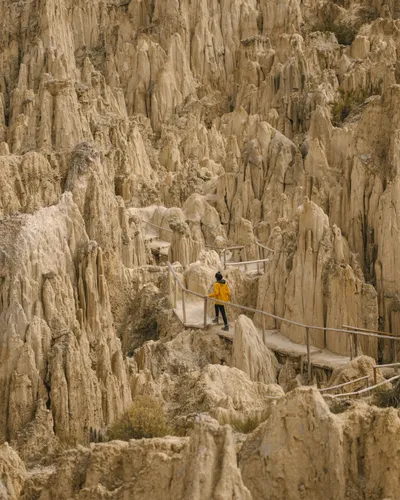 Valle de la Luna: a visitor on the boardwalk among smaller pinnacles