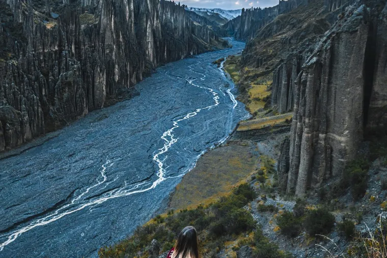 The river winding through Palca Canyon between walls of spires, seen from above