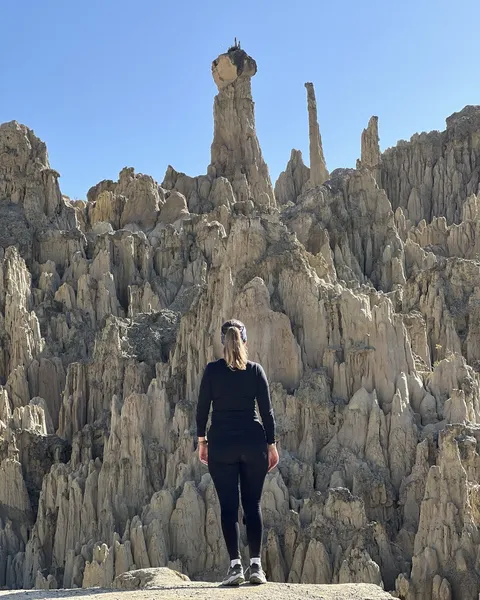 A hiker below the tallest spires on the circuit
