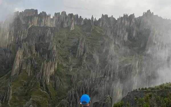 Valle de las Ánimas: a hiker among tall spires in the mist