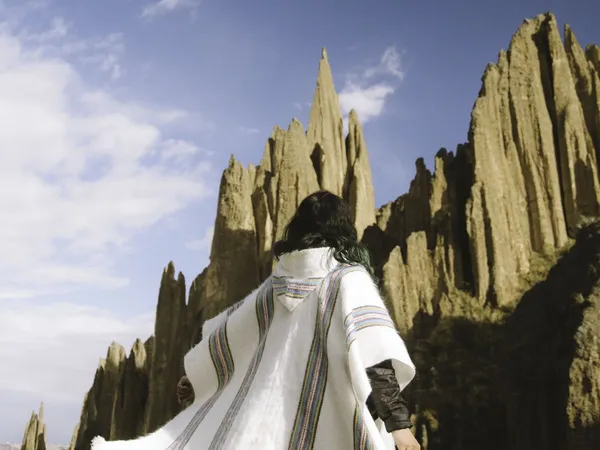 A traveler in white among the spires