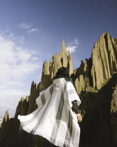 A traveler in white among the spires